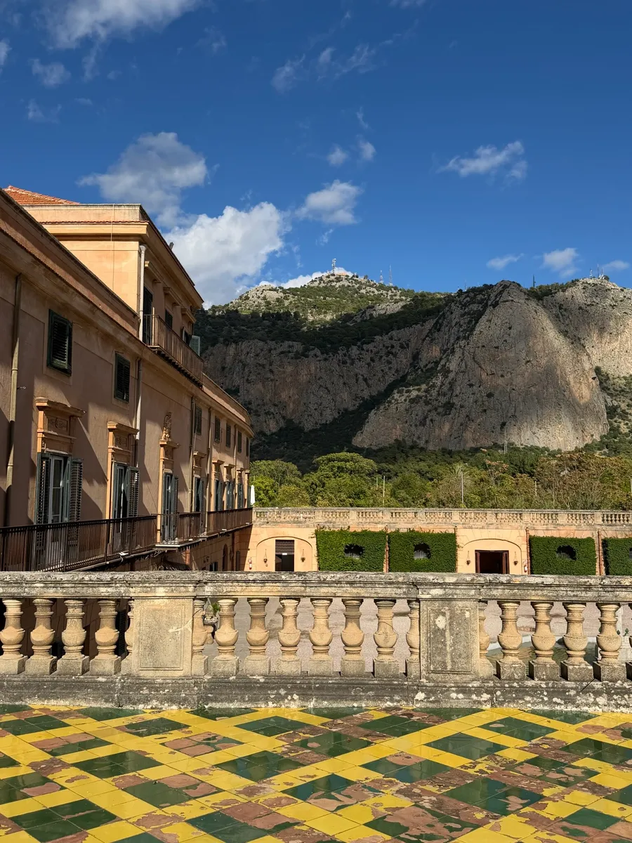 A terrace of yellow and green majolica tiles above Palermo